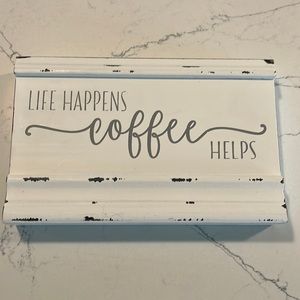 “Life Happens Coffee Helps” sign